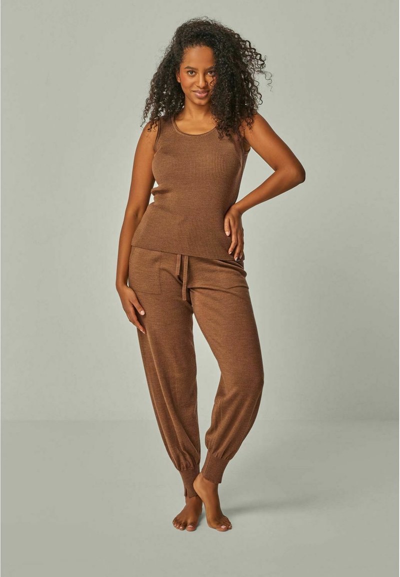 Brown ribbed tank top and matching tapered pants with elastic cuffs. Soft texture, fitted design, and drawstring waist.