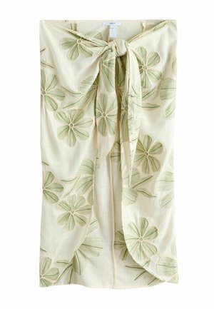 Krém színű szoknya nagy zöld hímzett virágokkal és elöl megkötött csomós részlettel.