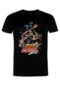 T-shirt en coton noir avec un imprimé graphique coloré de personnages et de vaisseaux spatiaux de Star Wars, avec "STAR WARS" affiché de manière proéminente.