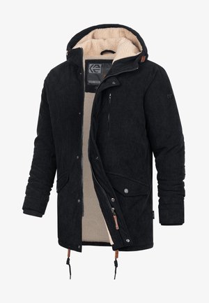 Veste en velours côtelé noir avec une doublure en fausse fourrure, capuche ajustable, poches avant et poche poitrine zippée. Comprend un cordon de serrage à l'ourlet.