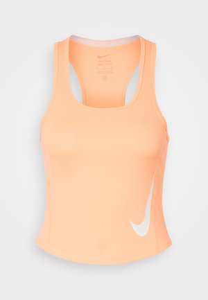 Lyseorange Nike Dri-FIT ærmeløs atletisk tanktop med racerback og hvid Swoosh-logo på nederste højre side.