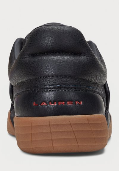 Black leather sneaker with a red "LAUREN" logo, textured upper, padded collar, and a brown rubber sole with a ribbed pattern.