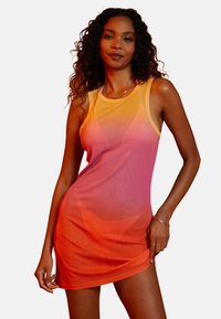 Gradient tank dress transitioning from orange at the hem to pink at the top, featuring a fitted design and soft, sheer fabric.