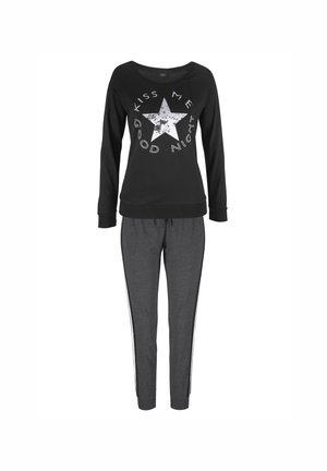 Black long-sleeve top with a white star graphic and text, paired with gray tapered pants featuring white side stripes. Cotton blend fabric.