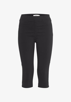 Pantaloni neri a gamba stretta, cropped, con vita elasticizzata e cuciture sui taschini anteriori, lunghezza alla caviglia con piccole fessure laterali.