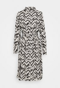 Black and white chevron patterned shirt dress with long sleeves, a high collar, front button closure, and a matching tied waist belt.