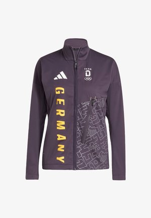 Giacca con zip color viola scuro con testo giallo "GERMANY", logo Adidas, emblema olimpico del Team Germany e tasca con zip decorata sul davanti.