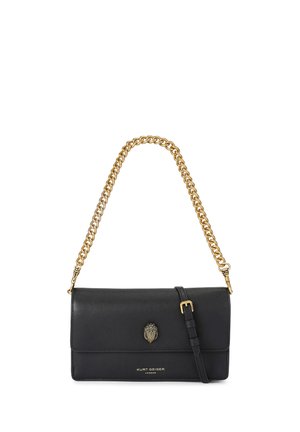 Black leather Kurt Geiger shoulder bag with gold chain strap and clasp, and adjustable leather buckle strap on white background.