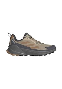 Beige og grå Adidas Terrex vandresko med snøredesign og robust sål til udendørs stier.