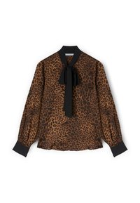 Bluzka w panterkę w kolorach brązowym i czarnym, z wiązaniem przy szyi, zapięciem na guziki na przodzie oraz bufkami z kontrastowymi czarnymi mankietami.