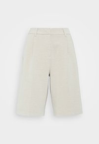 Tökéletesre szabott bézs vászon culotte nadrág, lapos elülső résszel, két oldalsó zsebbel, és térd alá érő fazonnal.