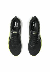 Black athletic shoes with a mesh upper and lime green accents. The Asics logo is visible on the tongue and side of each shoe.