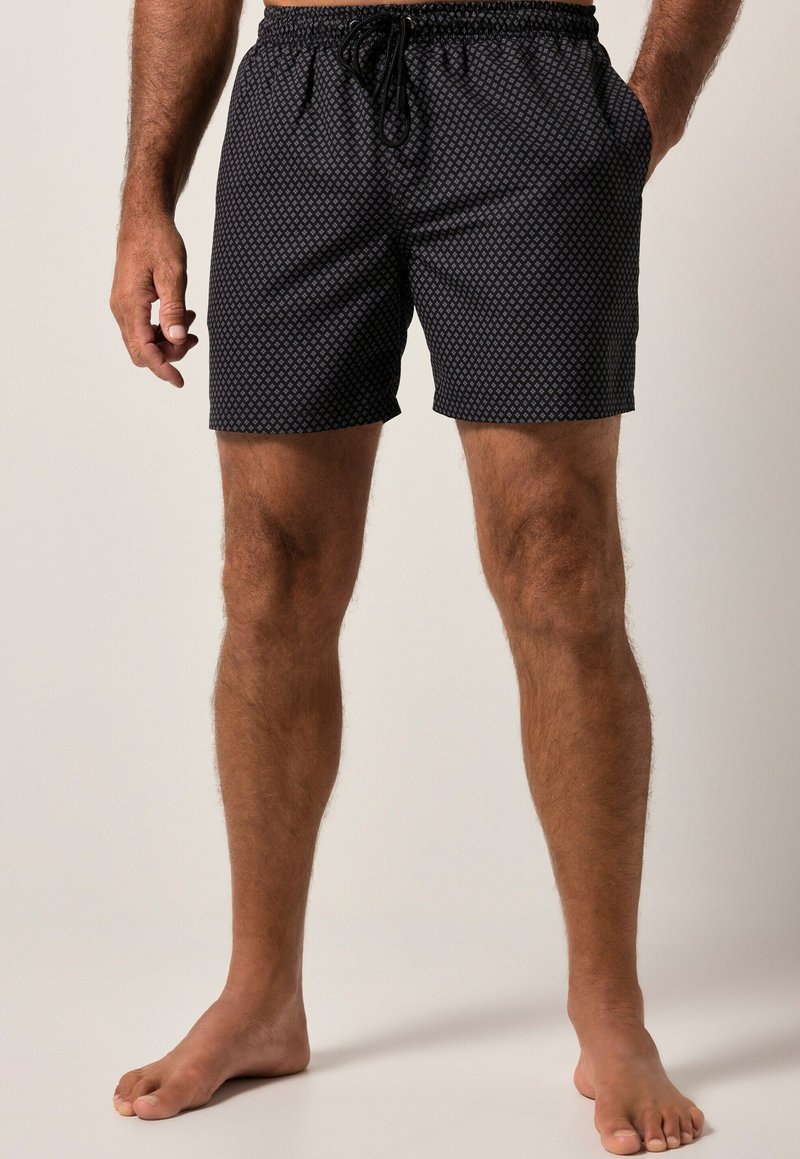 Schwarze Badeshorts mit geometrischem Muster, elastischem Bund, Kordelzug, zwei Seitentaschen und lockerer Passform. Mischgewebe aus Baumwolle.