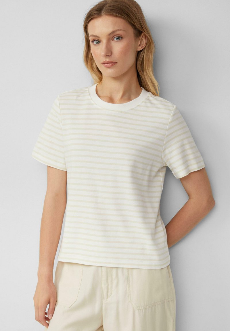 Cremefarbendes T-Shirt mit dezenten hellgelben Streifen, rundem Ausschnitt und kurzen Ärmeln. Weiches Material mit lockerer Passform.