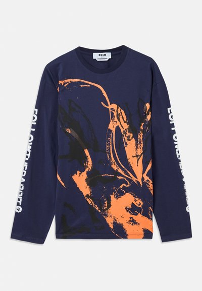Navy long-sleeve t-shirt made of cotton featuring an orange and black abstract design. Text on sleeve reads "FOLLOW THE RABBIT."