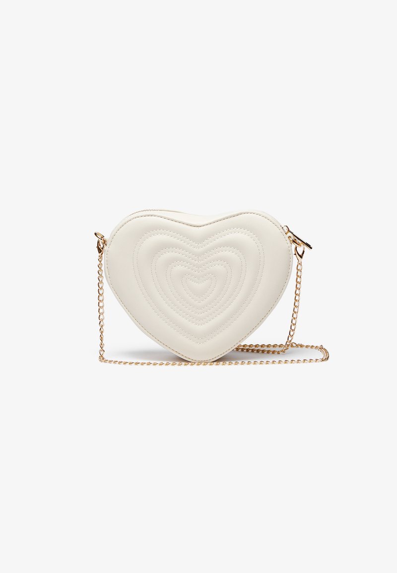 White heart-shaped crossbody bag made of faux leather with quilted concentric heart patterns and a gold chain strap.