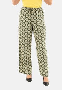 Pantaloni verdi a fantasia con un motivo a diamante di colore crema. Realizzati in tessuto leggero, con un elastico in vita per il massimo comfort.