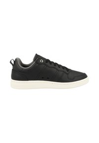 Black leather sneaker with a white rubber sole, lace-up design, gray padded collar, and small side perforations for ventilation.