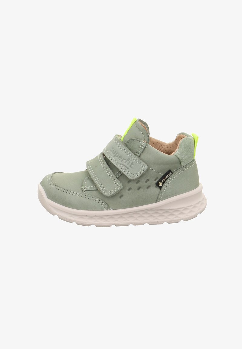 Hellgrüner Kinderschuh mit Klettverschlüssen und einem strukturierten Design. Verfügt über eine weiße Gummisohle, ein weiches Lederoberteil und einen neonfarbenen Akzent.