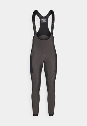 Black cycling bib tights featuring adjustable straps, padded seat area, and textured panels on the sides for added grip and support.
