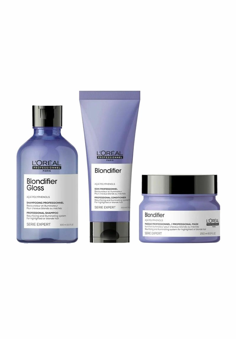 L'Oréal Professionnel Blondifier Haarpflege-Set mit Shampoo, Conditioner-Tube und professionellem Masken-Glas in lila und schwarzen Behältern.