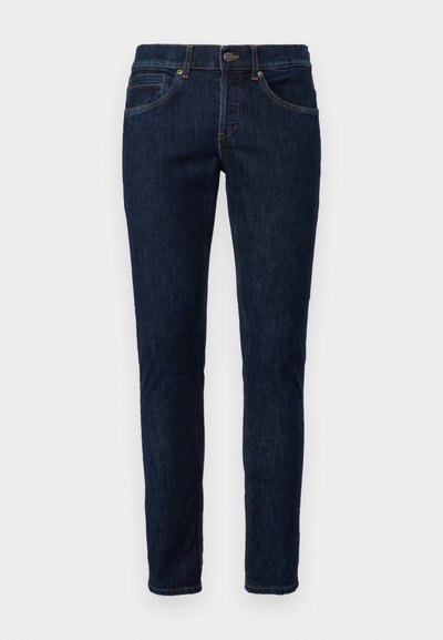 Jeans in denim blu scuro con un taglio slim. Presentano cinque tasche, una chiusura a zip e passanti per cintura. Cuciture di un colore contrastante.