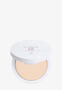 Polvo corrector de color CC de Lumene en un compacto blanco redondo. Polvo suave de color beige claro con una tapa con patrón y etiqueta "Vegano".