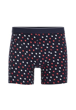 Bañadores de boxeo azul marino con patrones de semicírculos rojos y blancos. Cuentan con una cinturilla elástica y una tela suave y transpirable.