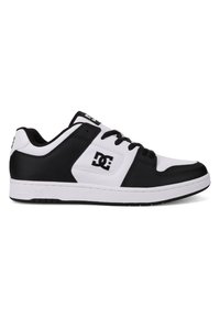Black and white low-top sneakers made of leather with a textured surface, featuring contrasting panels and a logo on the side.