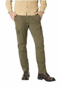 Olive green cargo pants with multiple pockets, zipper details, and a relaxed fit. Made from sturdy fabric, suitable for outdoor use.
