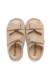 Beige suede sandals with two Velcro straps, open toe design, and a soft inner lining. Features a round toe and stitched accents.