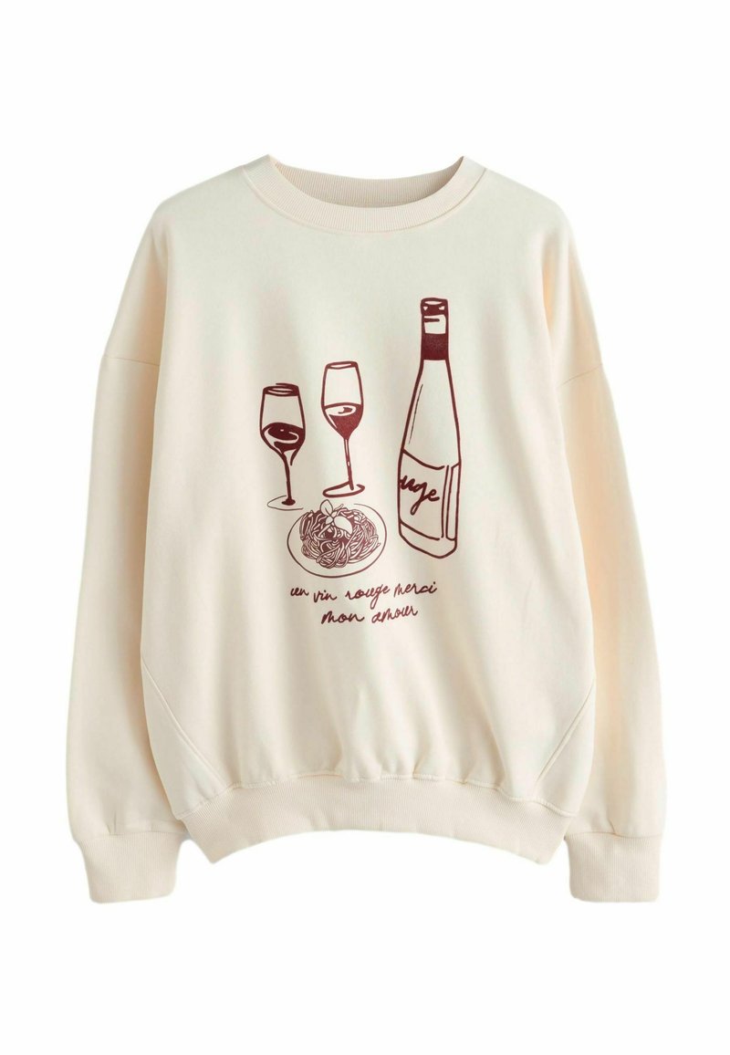 Sweatshirt couleur crème avec une impression bordeaux représentant une bouteille de vin, deux verres et une assiette de spaghetti. Col et poignets côtelés.