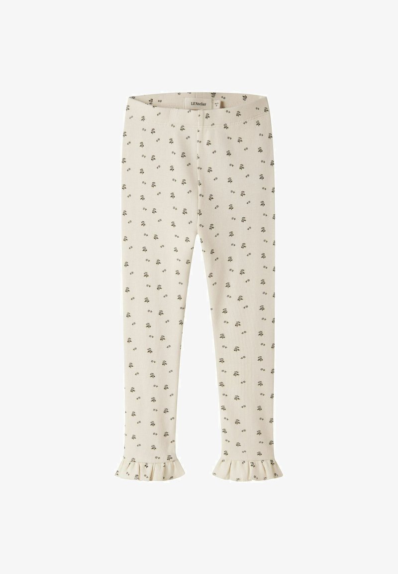Leggings côtelés couleur crème avec petit imprimé floral noir et ourlets à volants, taille 18-24 mois par Lil'Atelier.