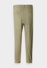 Kaki bukser med en glat overflade, tapered ben, elastisk talje og to baglommer. Letvægtsstof med en simpel finish.