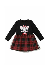 Schwarzes Langarmkleid mit Katzenmotiv, rotem Pünktchen-Bow und einem karierten Rock in Rot und Schwarz mit einem transparenten Overlay.