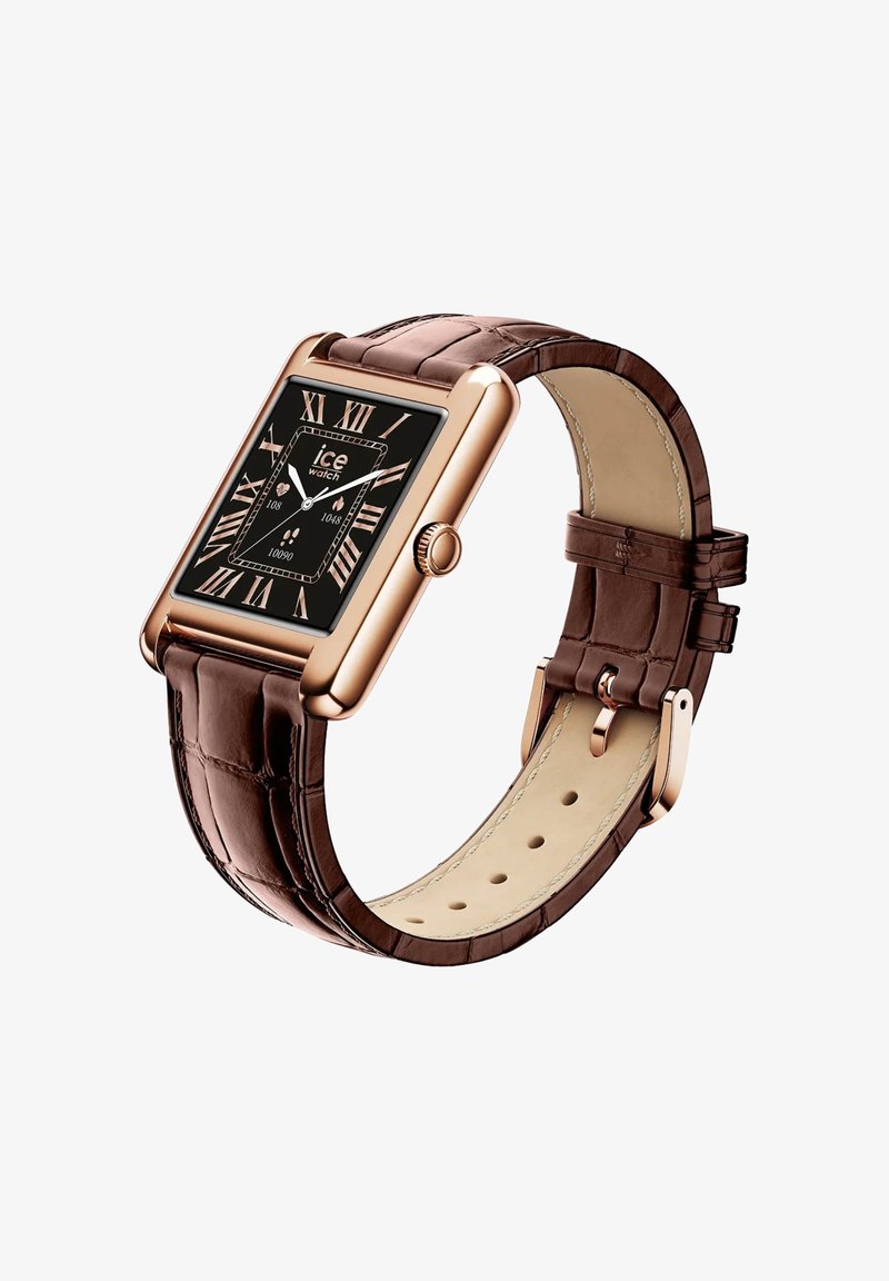 Rudas odinis laikrodis su stačiakampiu rožinės aukso metalo korpusu. Juodas ciferblatas su romėniškais skaičiais ir nerūdijančio plieno sagtimi.