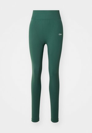 Grønne leggings med en glatt tekstur, høy midje og subtile logo detaljer foran. Tett design og full lengde dekning.