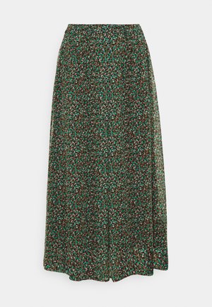 Long flowy skirt with small green, brown, and white floral pattern on semi-sheer fabric and elastic waistband.
