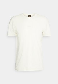 Biała bawełniana koszulka z okrągłym dekoltem i krótkimi rękawami, z napisem "BOSS" w jasnym odcieniu na przodzie.