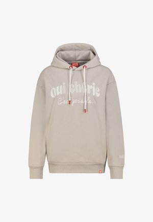 Hellbeiger Kapuzenpullover mit weißen Kordeln, roten Enden und weißem Text "oui chérie C'est possible" auf der Vorderseite.