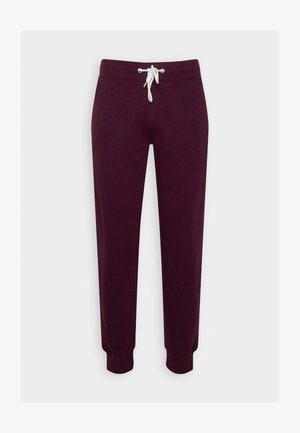 Pantalons de jogging bordeaux fabriqués en tissu doux, avec une taille élastique dotée d'un cordon de serrage blanc, des jambes fuselées et des poignets côtelés.