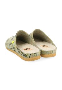 Zapatillas de fieltro tipo slip-on en verde con una superficie texturizada y dibujos en línea negra. Interior suave en blanco y suela de goma natural.