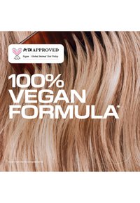 Hellbraune Haarsträhnen mit einem dunklen Kamm und Text, der eine 100-prozentige vegane Formel mit PETA-Zulassung für keine tierischen Inhaltsstoffe angibt.