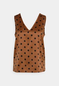 Haut marron sans manches avec un décolleté en V orné de grands pois noirs. Fabriqué dans un matériau lisse et brillant avec une coupe décontractée.