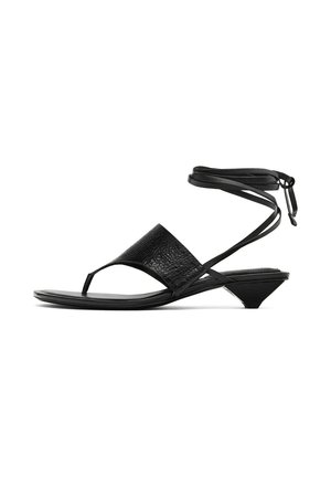 Black leather sandals featuring a textured front, ankle strap detail, and a low triangular heel. Minimalist design with open toe.