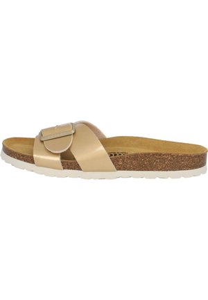 Beige slide sandal med en glat, blank overdel, kork fodseng og en hvid, struktureret gummisål. Har en dekorativ spænde detalje.