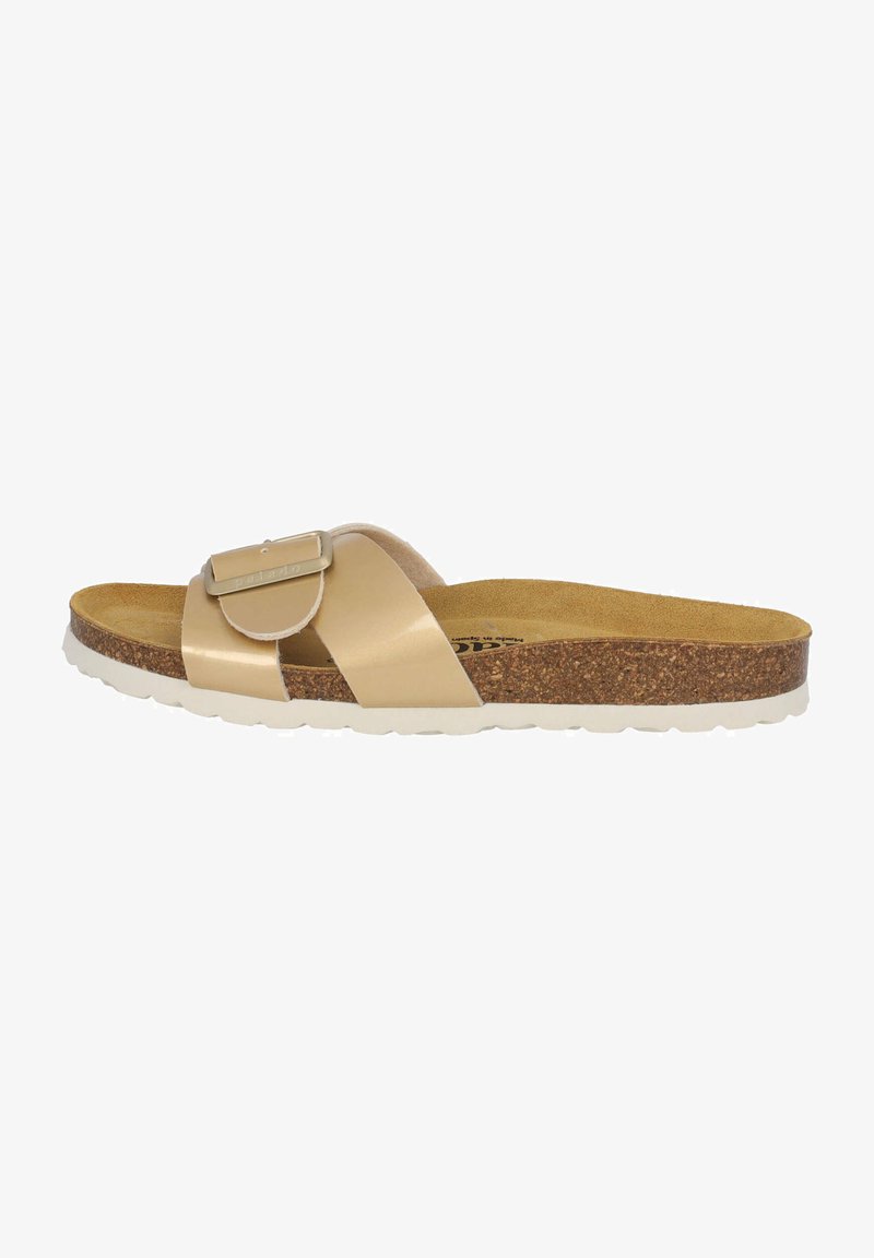 Beige glidsandal med en jämn, blank överdel, korkfotbädd och en vit, texturerad gummisula. Har en dekorativ spänndetalj.