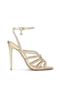Gold high-heeled sandals with multiple crystal-embellished straps and an ankle strap, featuring a smooth metallic finish and a pointed toe.