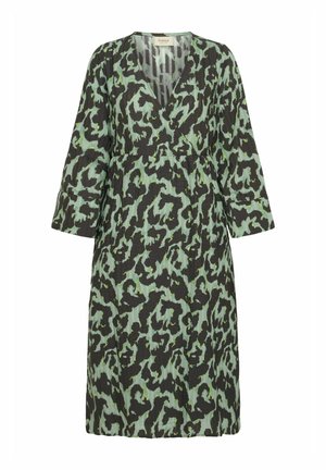 Green and black patterned dress with a V-neckline and three-quarter sleeves, made of lightweight fabric with a textured finish.