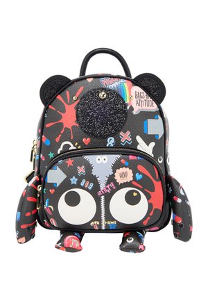 Black backpack shaped like a cartoon bear with large eyes, glittery nose, ears, and colorful graphic patches and text all over.